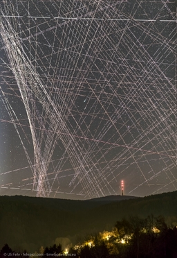 Comet R3 PanSTARRS Behind Satellite Trails