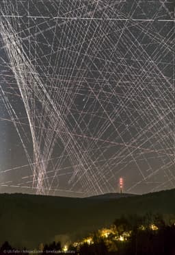 Comet R3 PanSTARRS Behind Satellite Trails